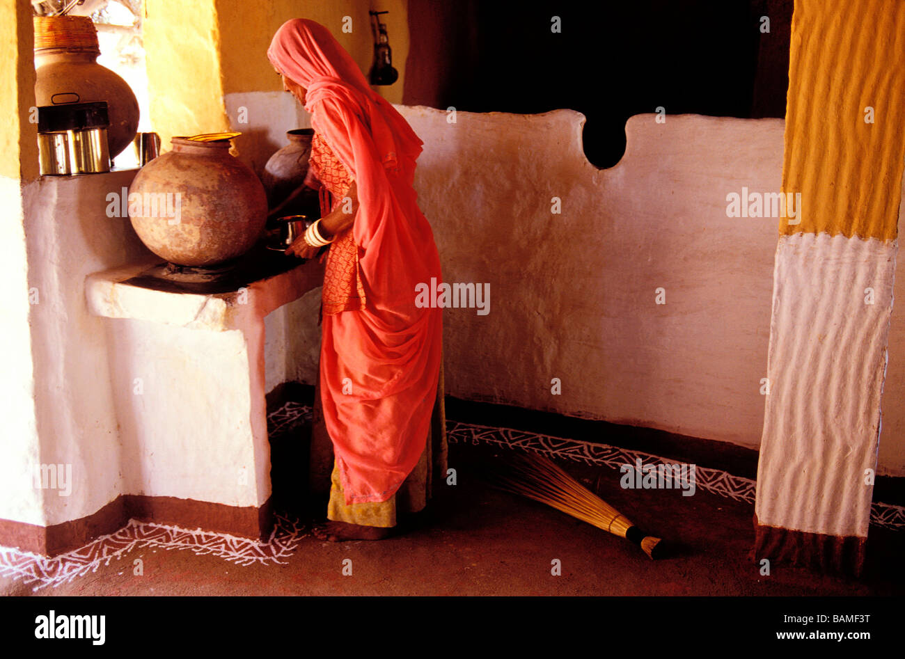 India, Rajasthan State, village near Jodhpur, woman in her kitchen Stock Photo