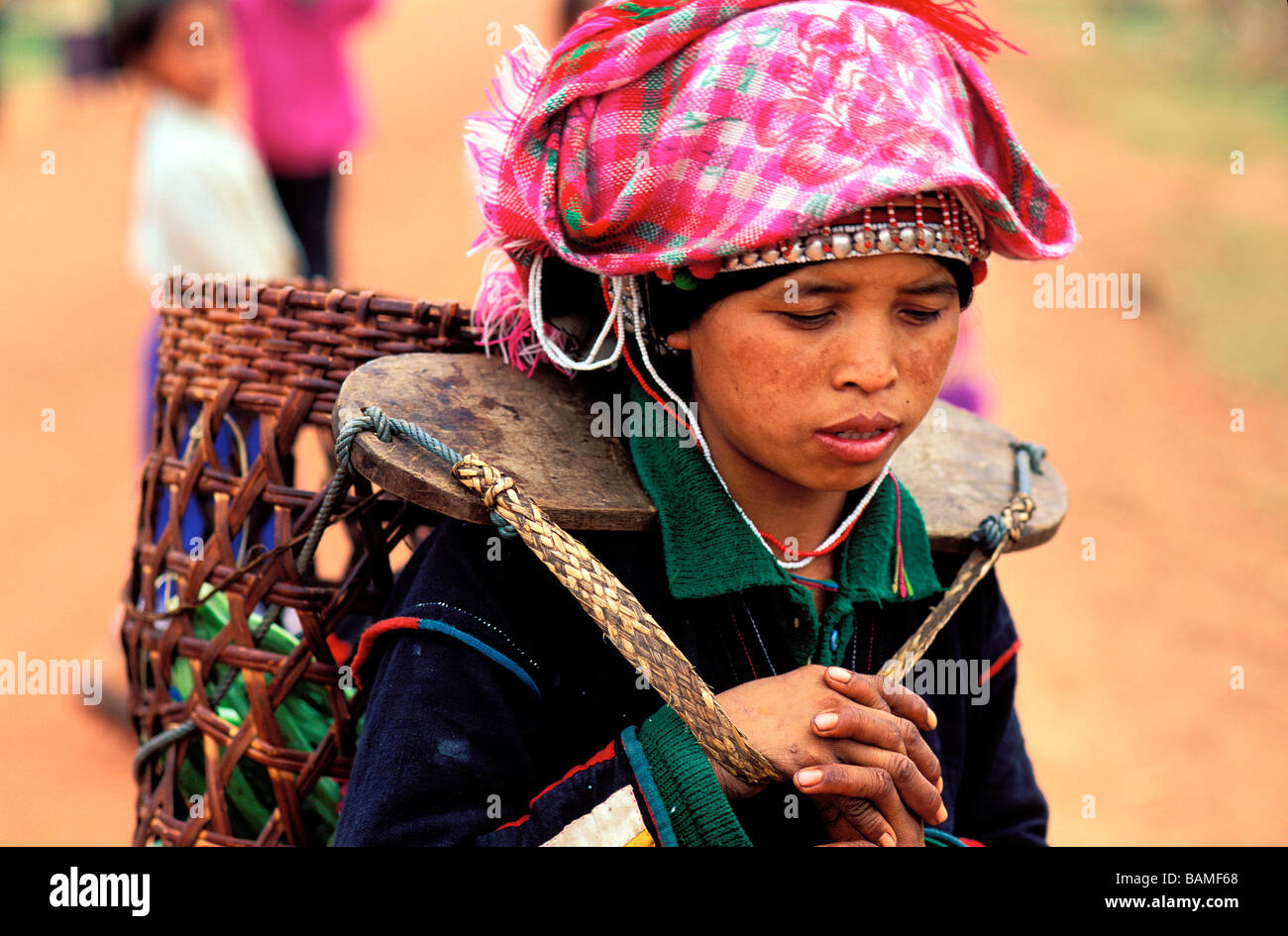 Laos, Luang Namtha Province, Muang Sing,  Iko Ethny, Iko woman carrying a basket Stock Photo