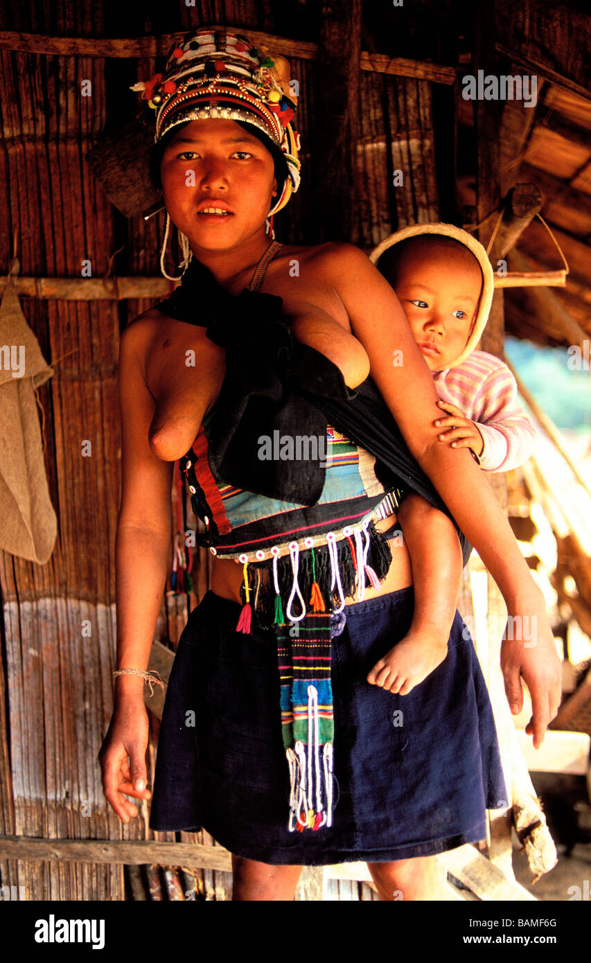 Laos, Luang Namtha Province, Muang Sing, Ethnie Iko, woman carrying her baby Stock Photo