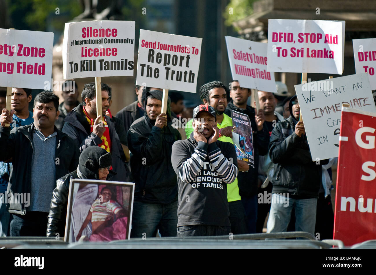 Demonstrators holding placards at the Tamil demonstration in London.  Photo by Gordon Scammell Stock Photo