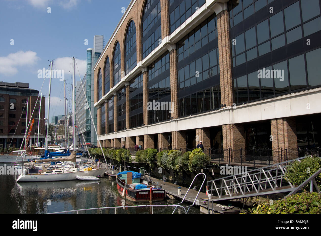 modern flats leisure boats st katharines dock thames path north bank