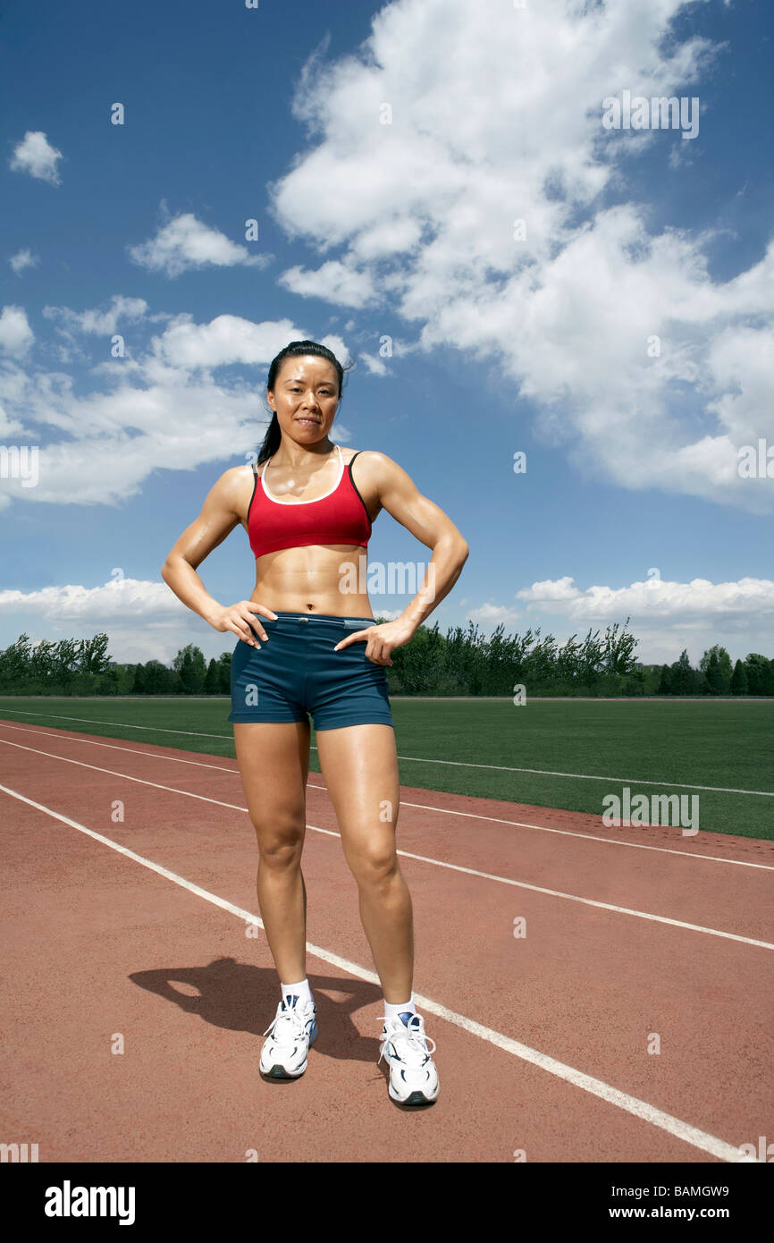 Portrait Of Athlete Standing On A Track Field Stock Photo Alamy