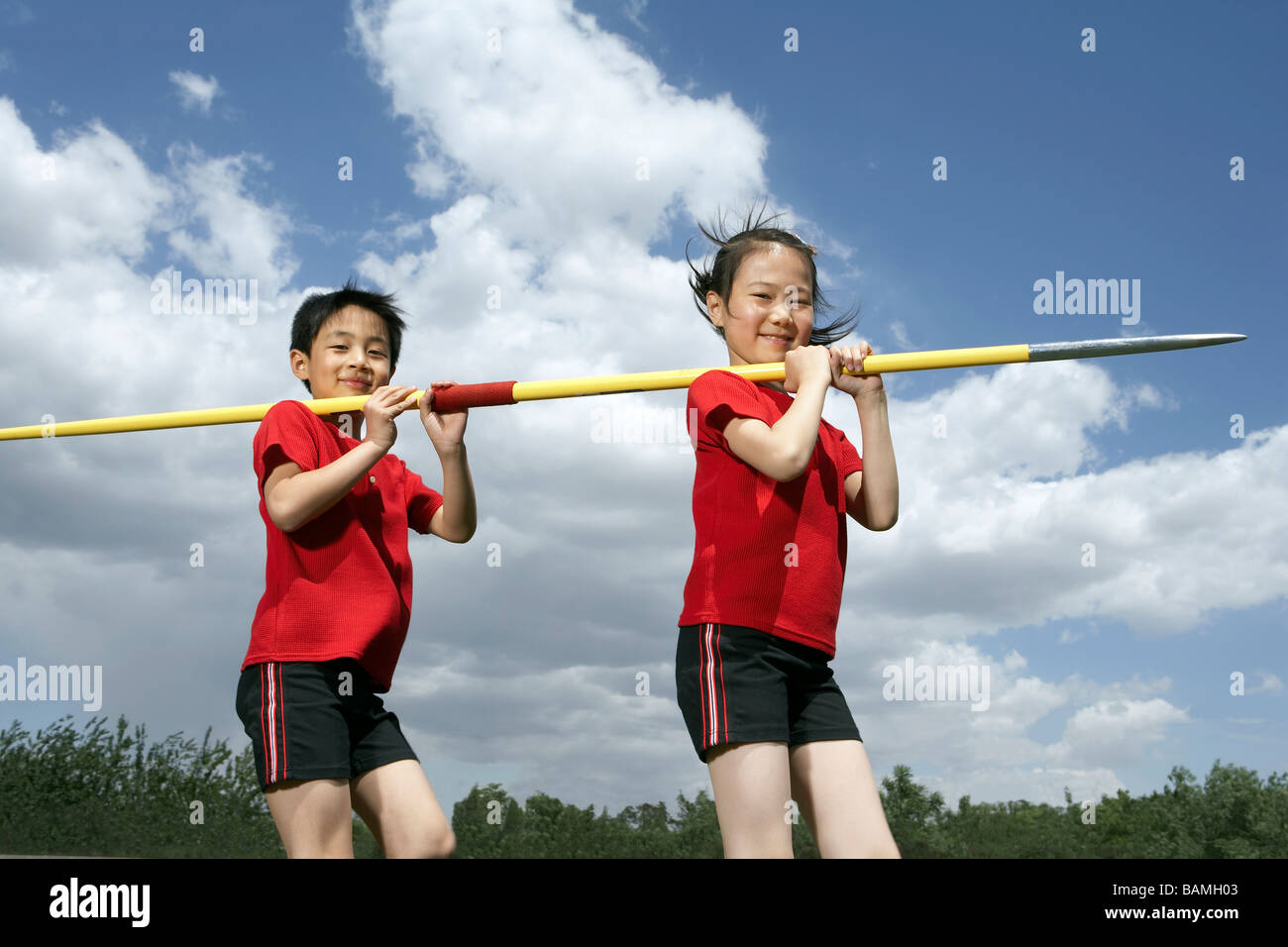 Children Holding A Large Javelin Stock Photo Alamy