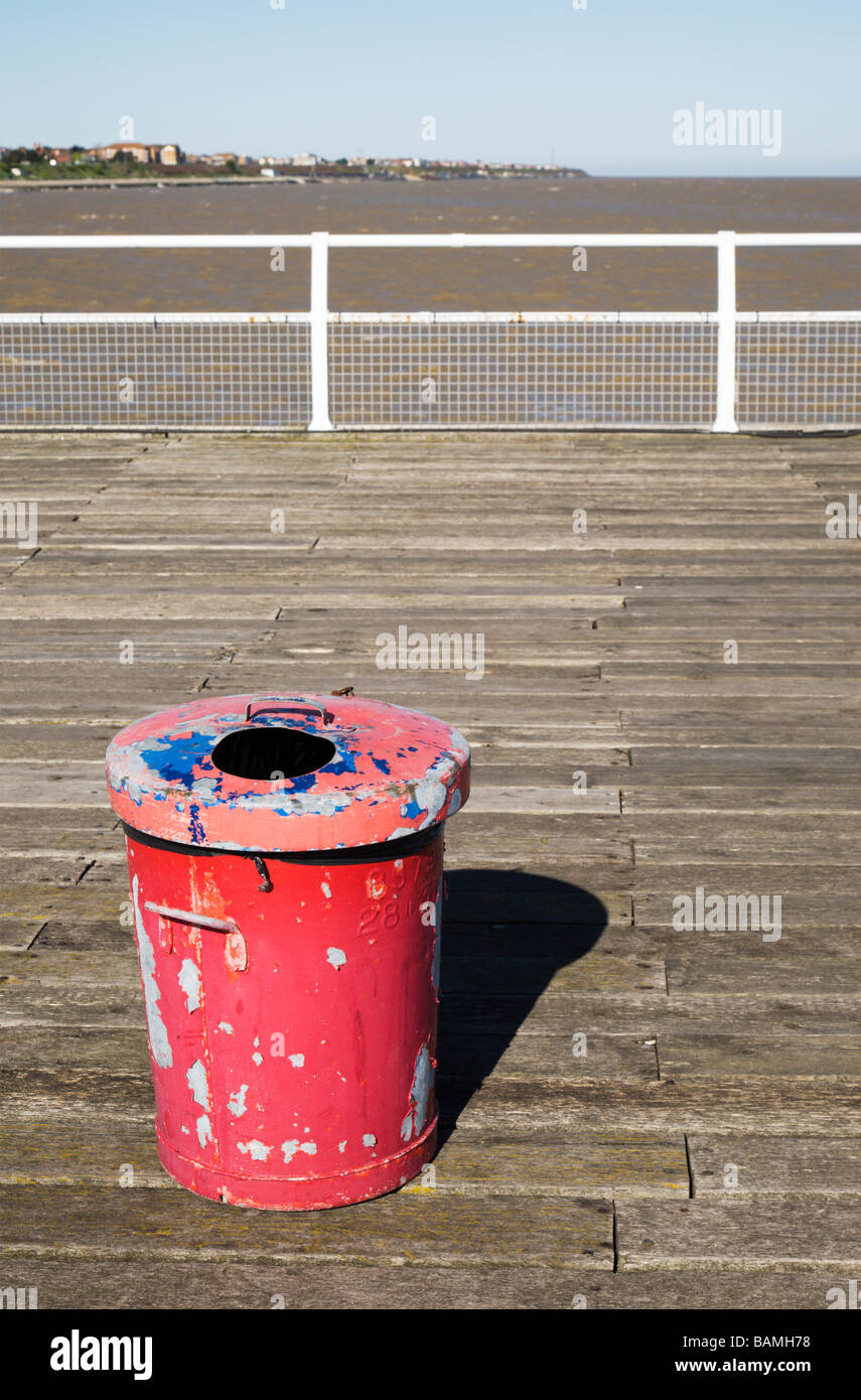 A red rubbish bin on Clacton Pier. Stock Photo