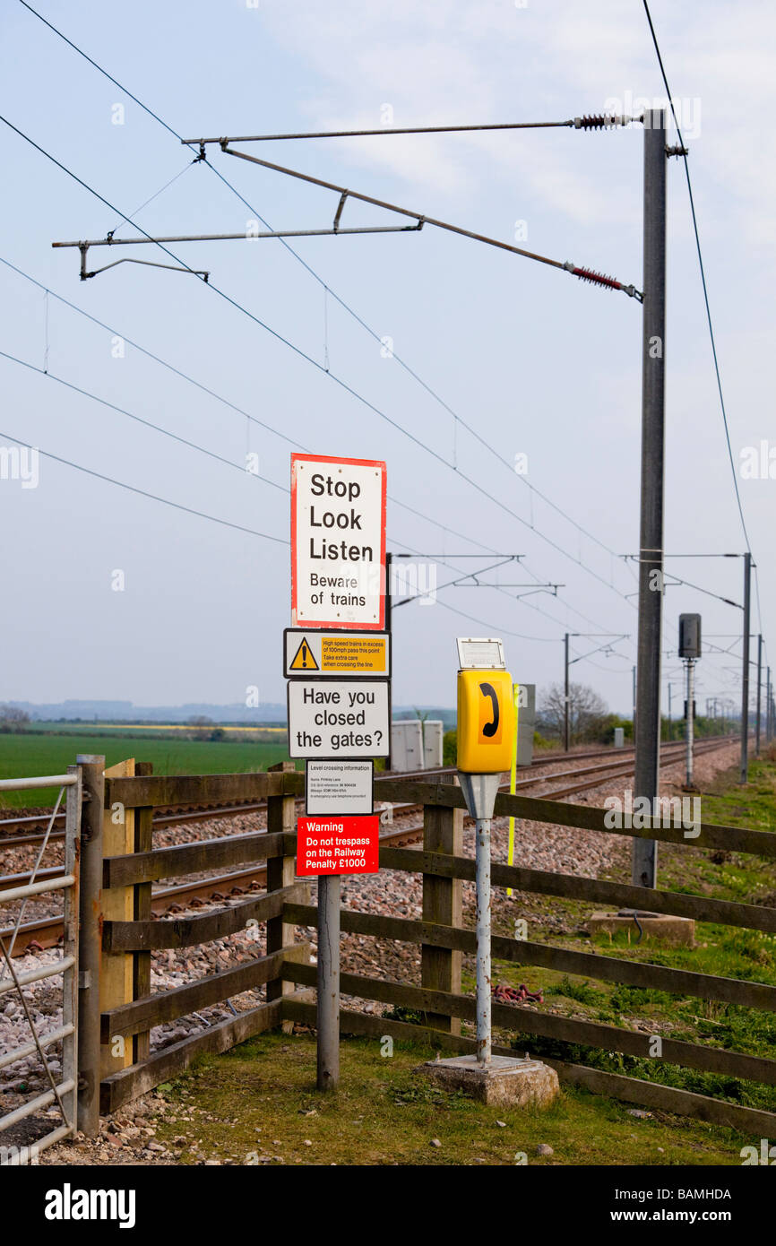 Railway line danger warning signs, Marston, Grantham, Lincolnshire, England Stock Photo