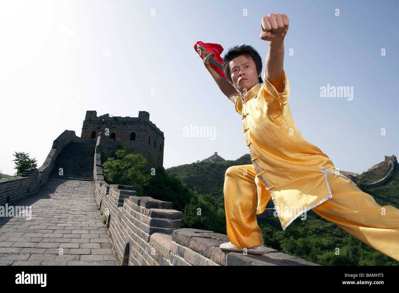 Man Practicing Martial Arts In Traditional Dress On The Great Wall Of