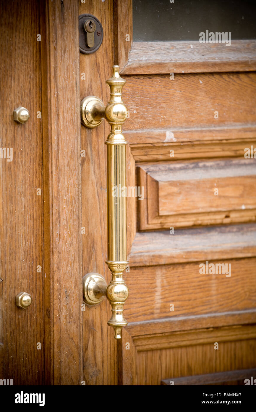 new gloss door knob on old door Stock Photo