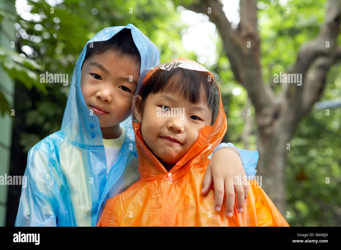 Children Standing With Arms Around Each Other Stock Photo - Alamy