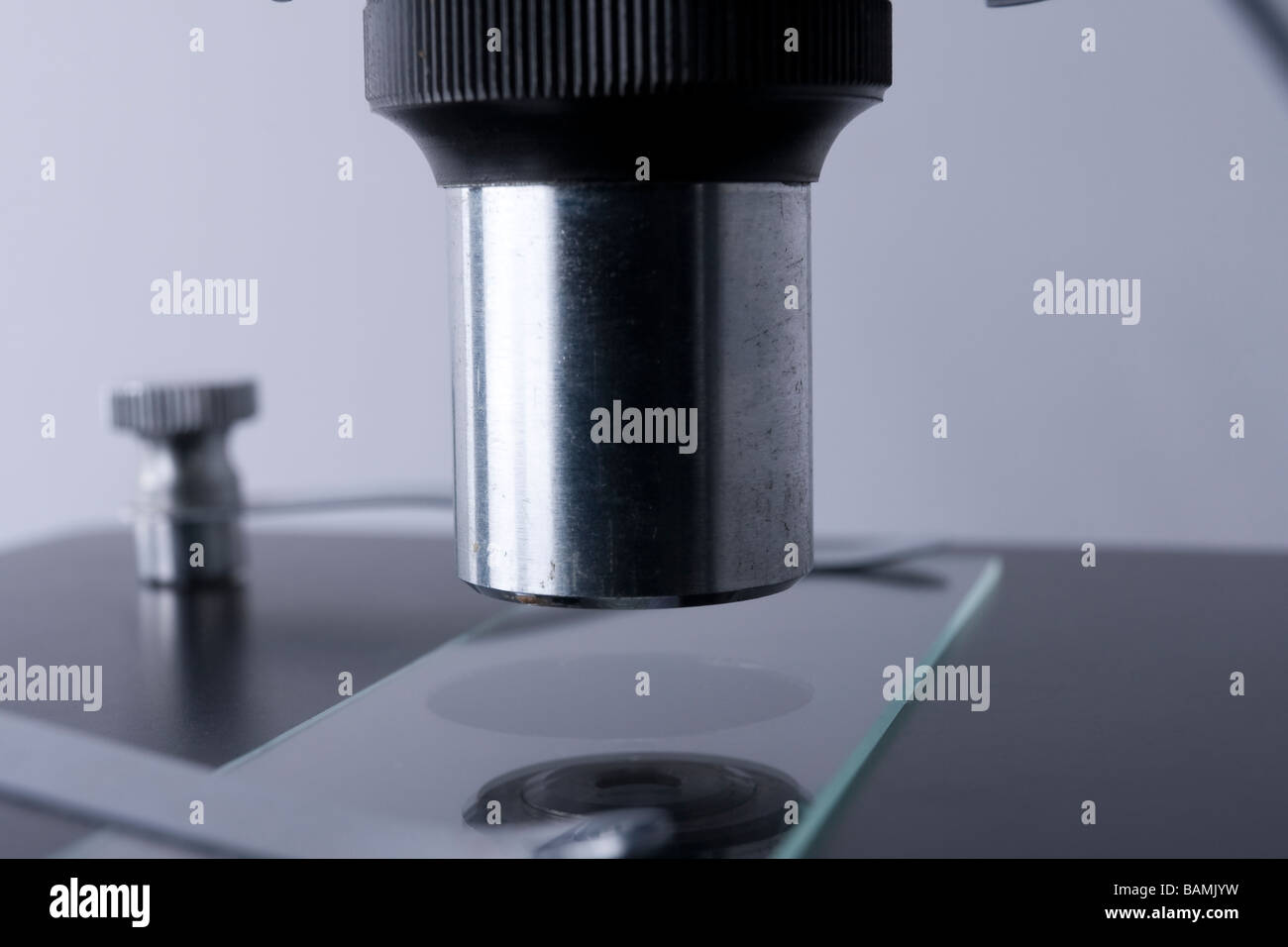 Side detail of the objective lens on a microscope Stock Photo