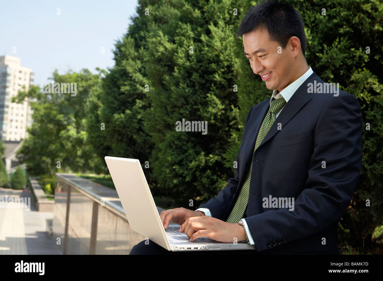 Businessman Typing On Laptop Stock Photo