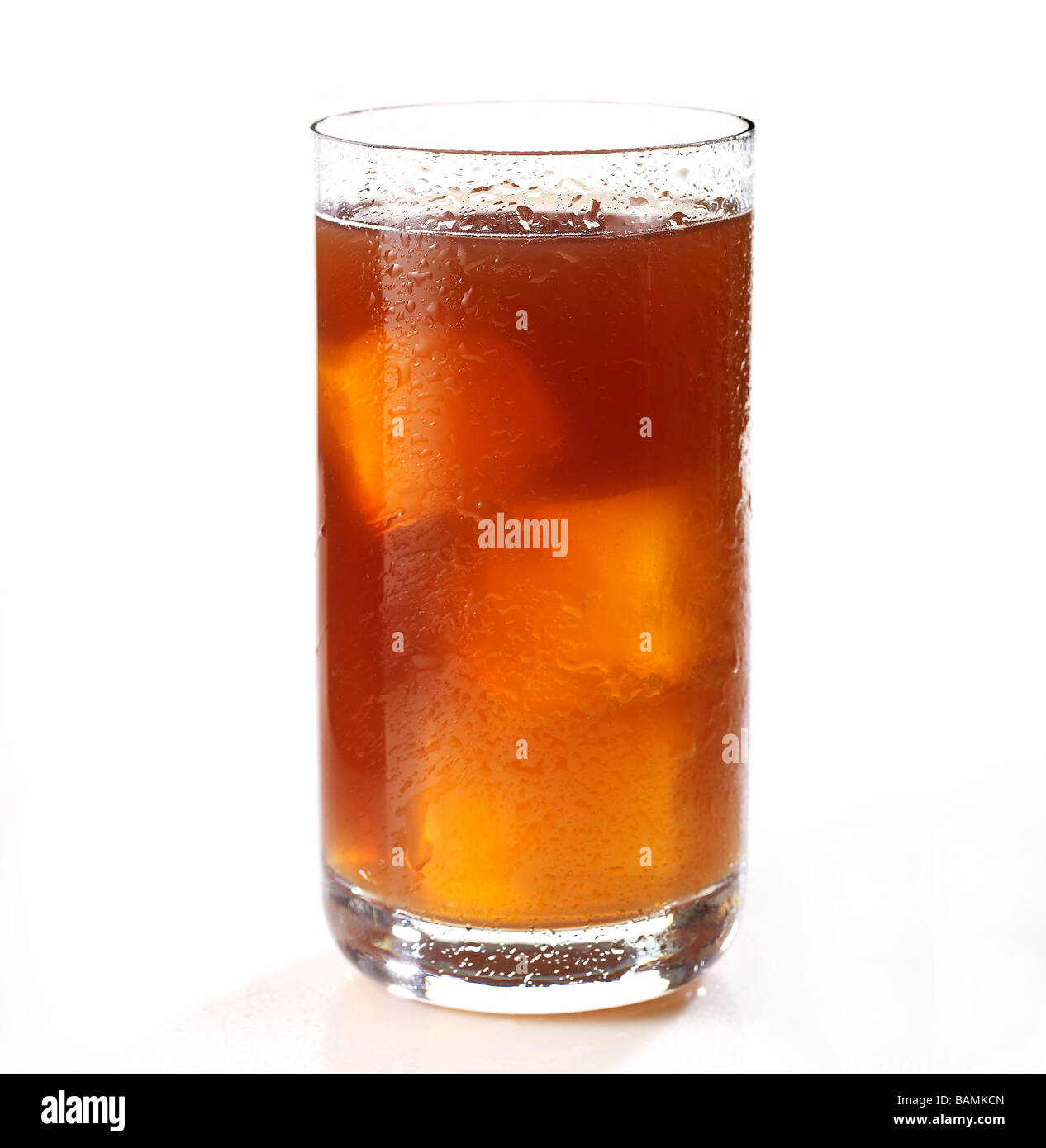 Iced Tea in a tall glass on a white surface Stock Photo