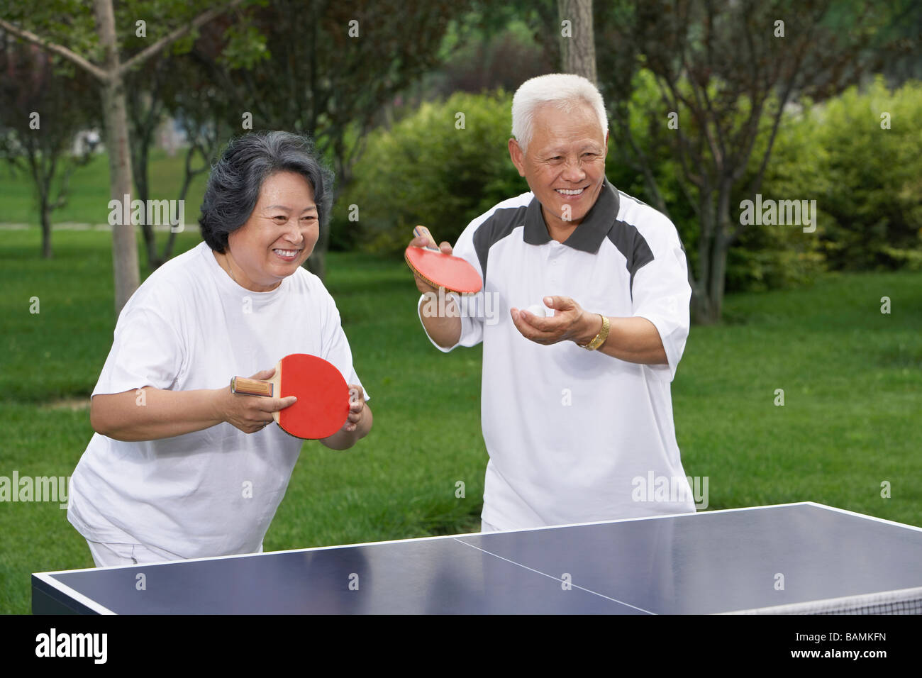 Elderly Couple Playing Ping Pong Stock Photo