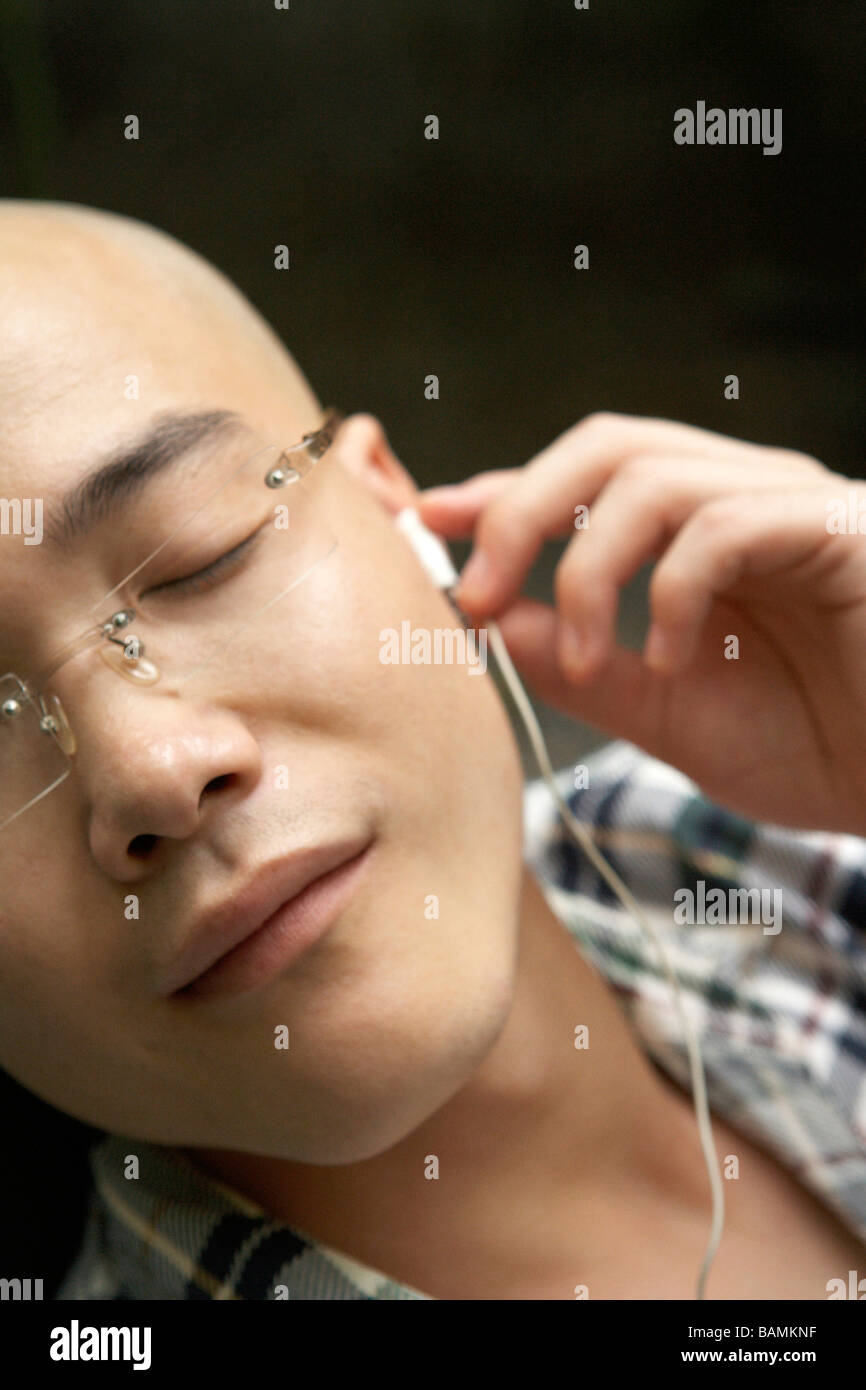 Chinese man relaxing close up eyes shut hi-res stock photography and images  - Alamy