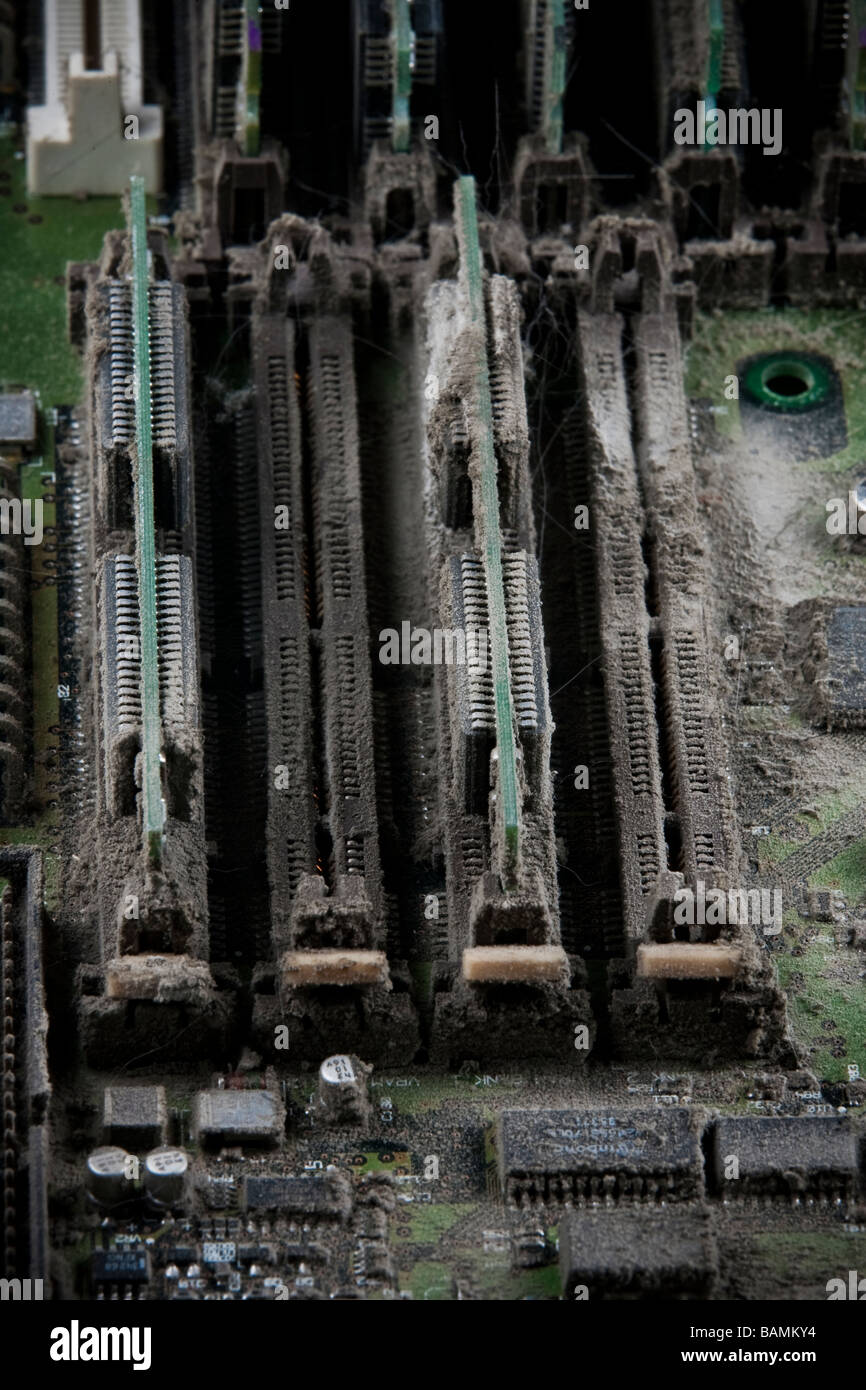 Detail of a printed circuit board removed from a computer covered with dust Stock Photo