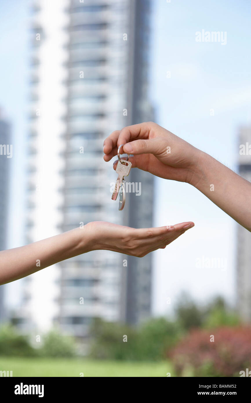 Hands Exchanging A Key Stock Photo Alamy