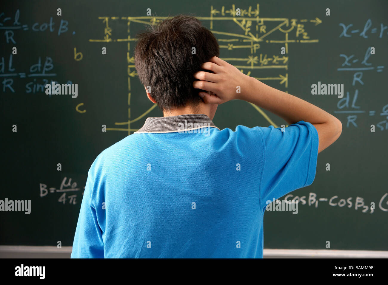 Student Looking At A Blackboard In A Classroom Stock Photo Alamy