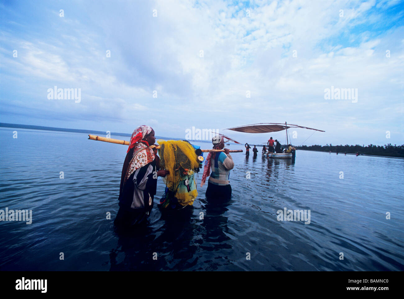 Fisherwomen bring gill net after night of fishing Inhambane Mozambique  Stock Photo