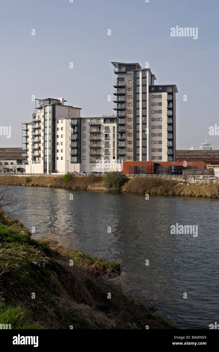 Modern apartment block flats building, River Taff in Cardiff, Wales UK