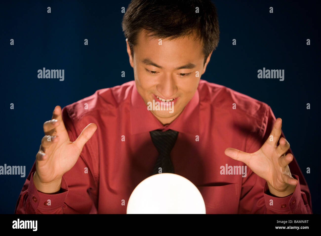 Businessman Looking Into Crystal Ball Stock Photo Alamy