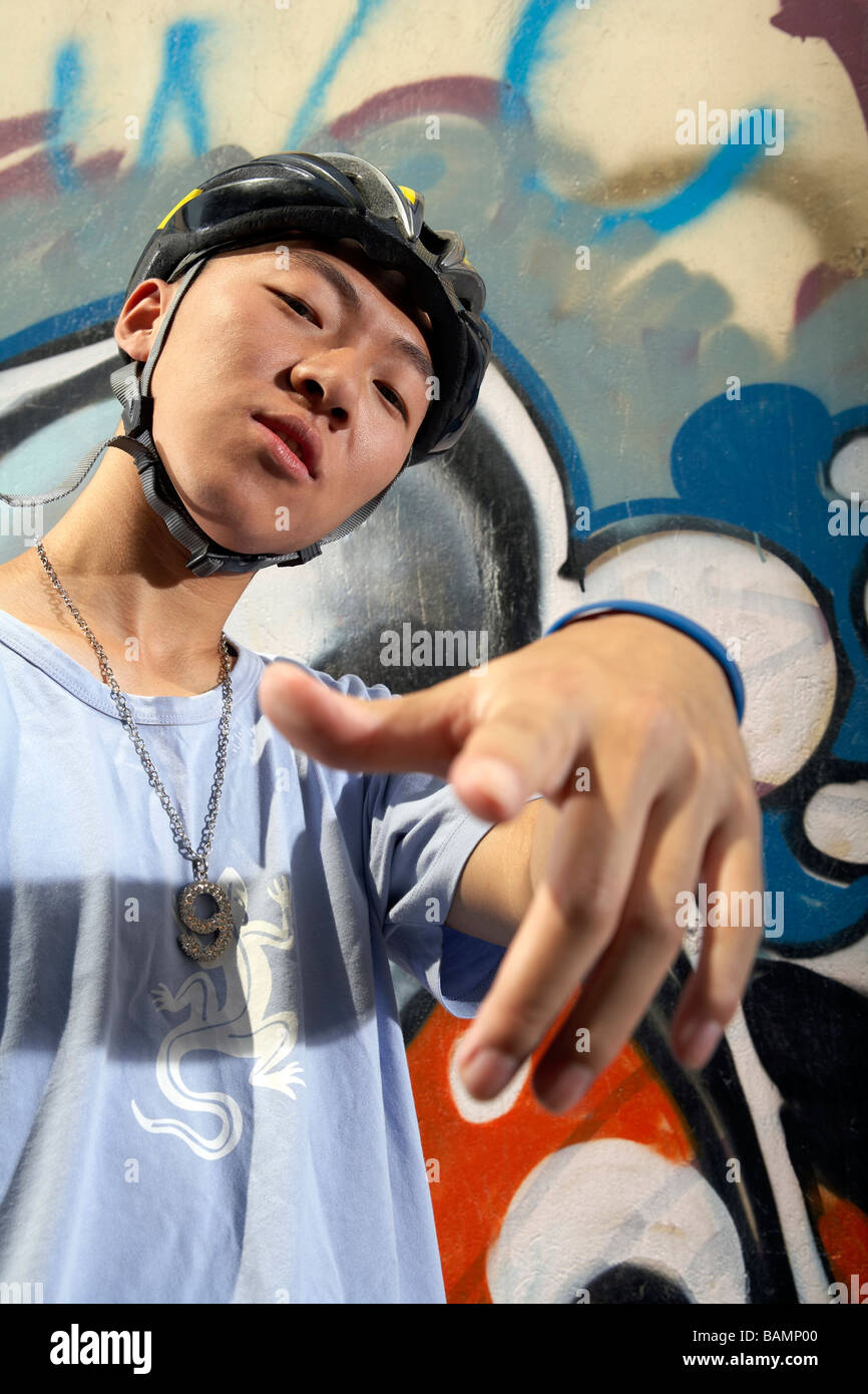 Teenage Boy Wearing Helmet And Pointing Stock Photo Alamy