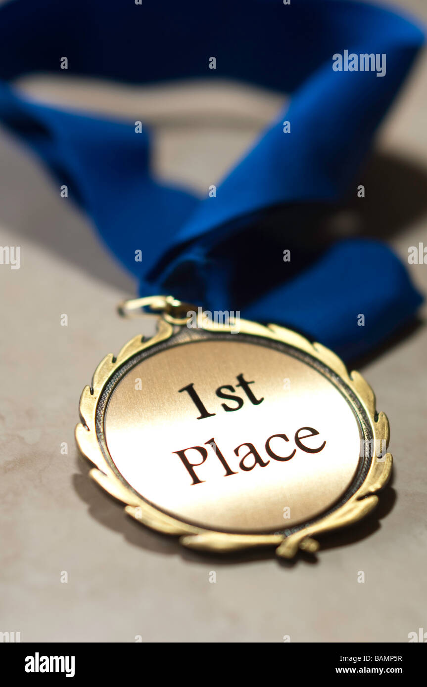 First place medal with blue ribbon Stock Photo