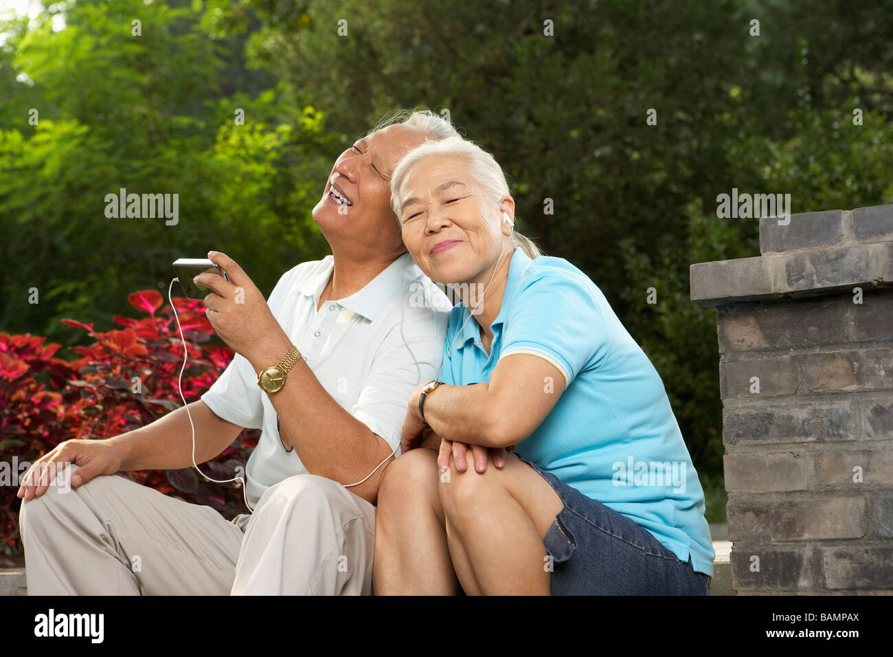 Older Couple Listening To MP3 Player Together Stock Photo Alamy