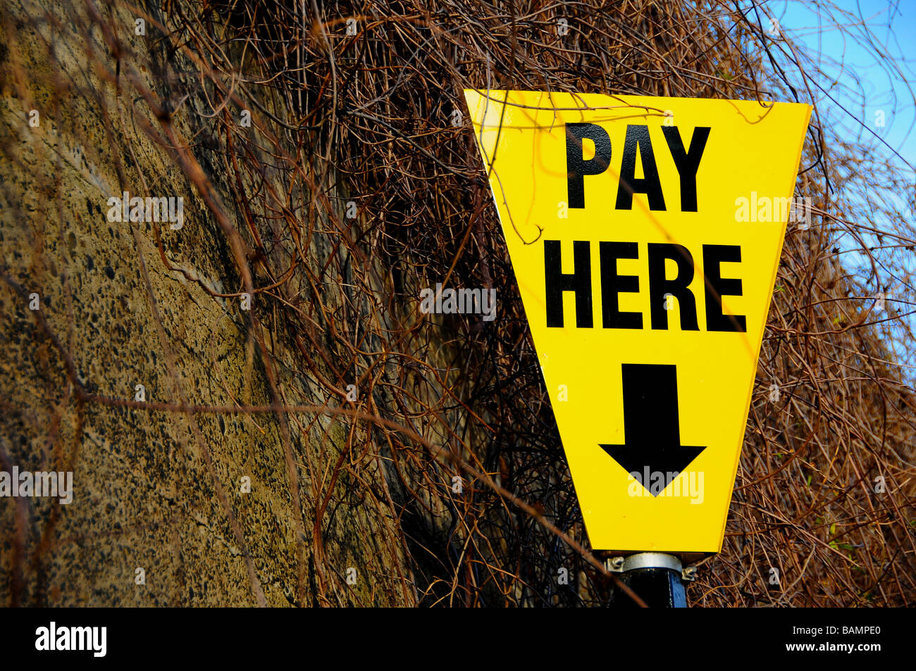 'Pay Here' sign in a pay and display car park (England) Stock Photo