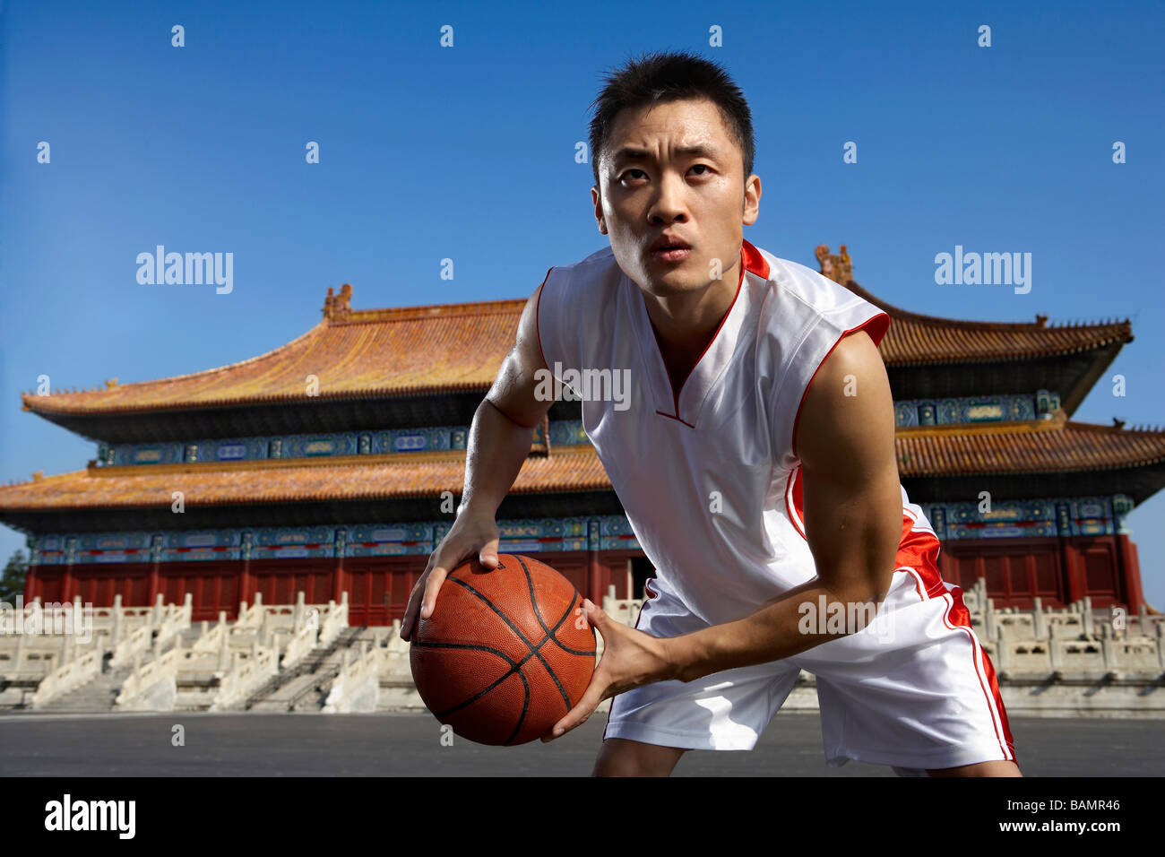 Portrait Of Young Basketball Player In Front Of Temple Stock Photo