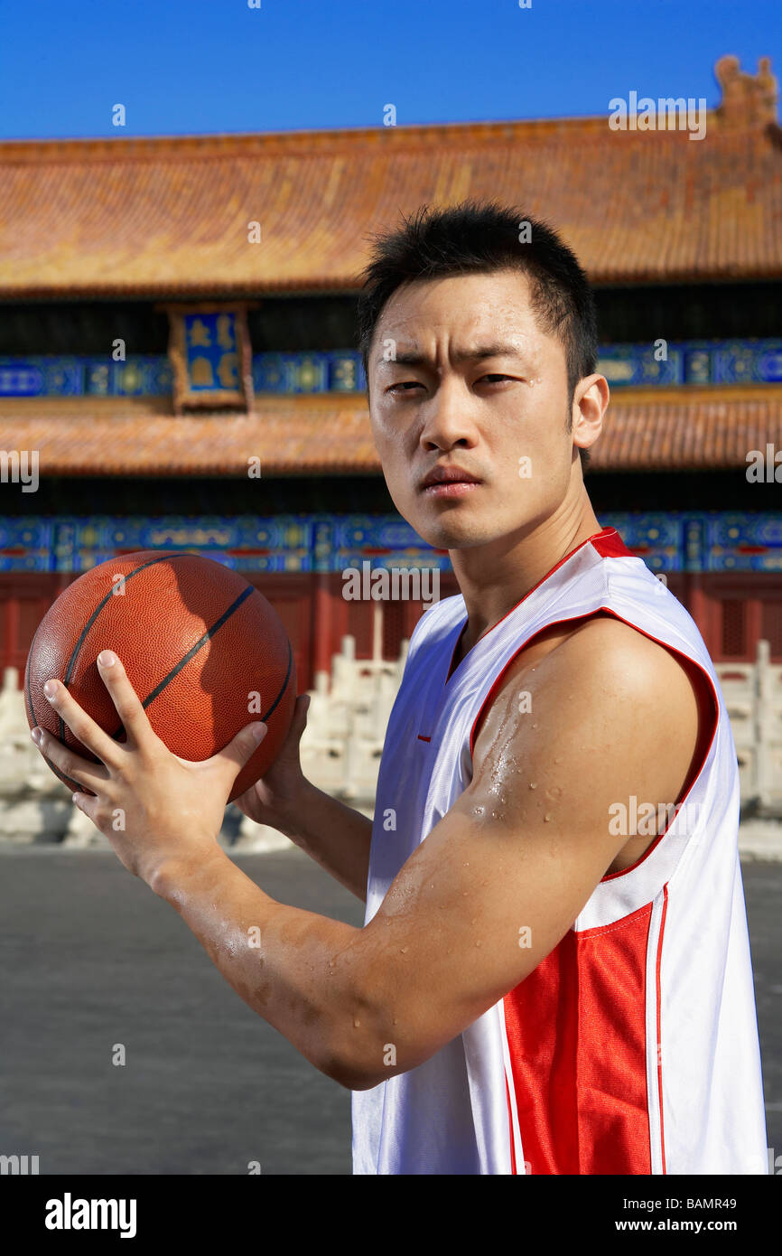 Portrait Of Young Basketball Player In Front Of Temple Stock Photo