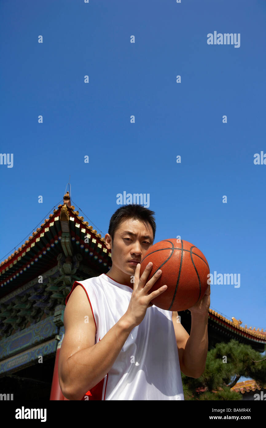 Portrait Of Young Basketball Player In Front Of Temple Stock Photo