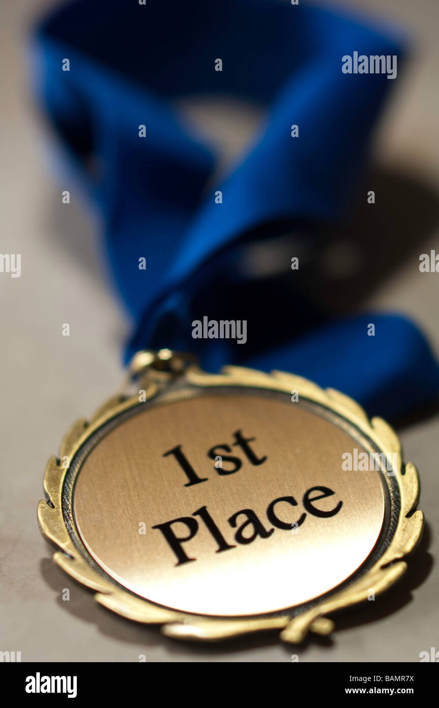 First place medal with blue ribbon Stock Photo