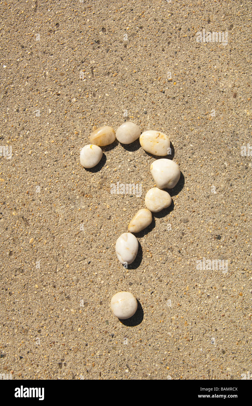 question mark formed of small white stones Stock Photo