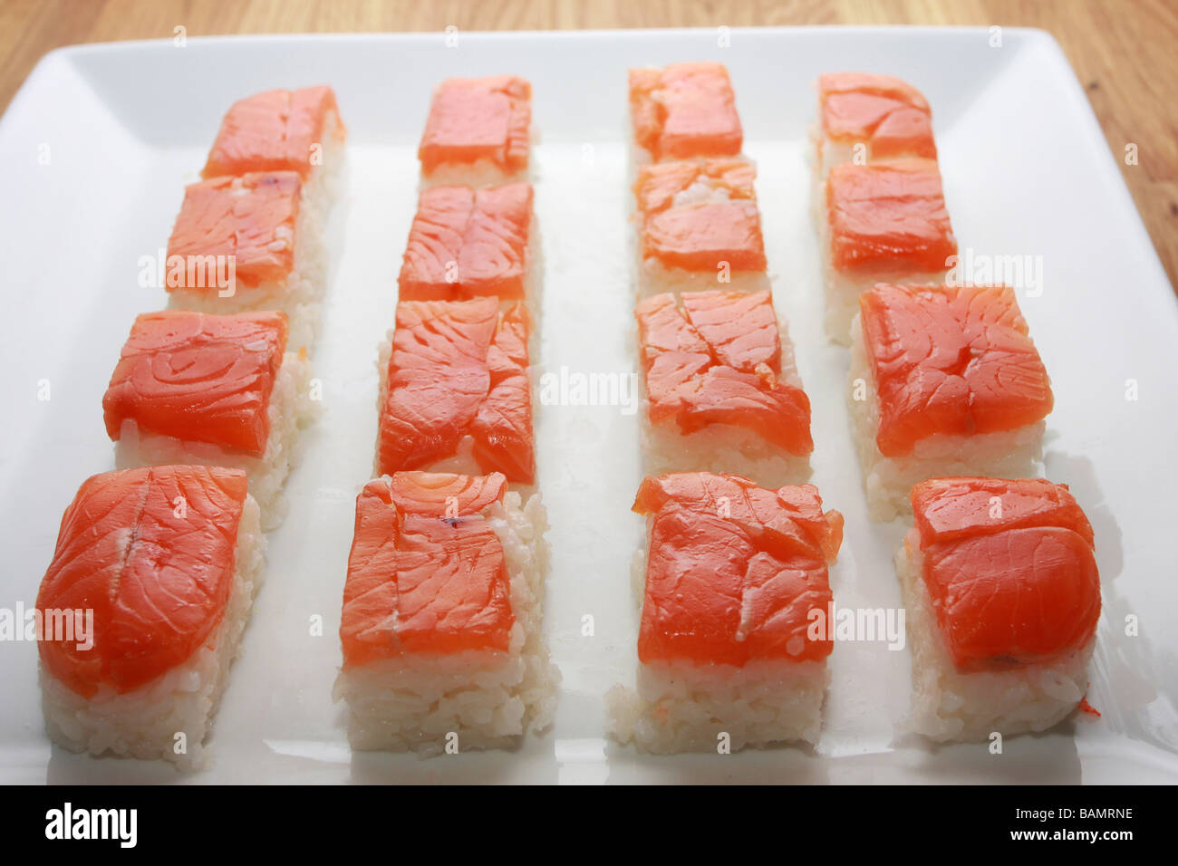 Salmon Nigiri Sushi On A A White Dish Stock Photo Alamy