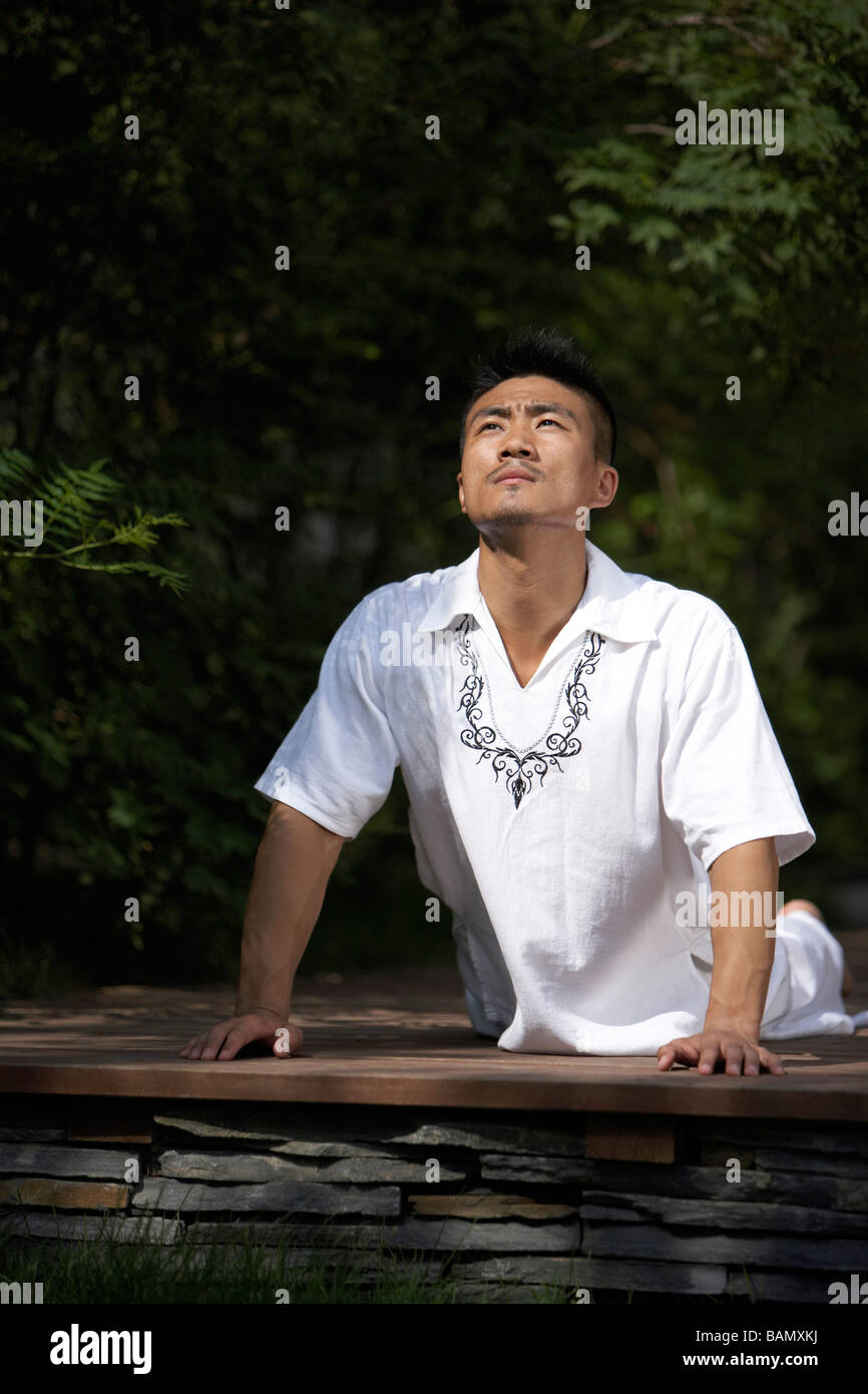 Man Meditating Outdoors Stock Photo