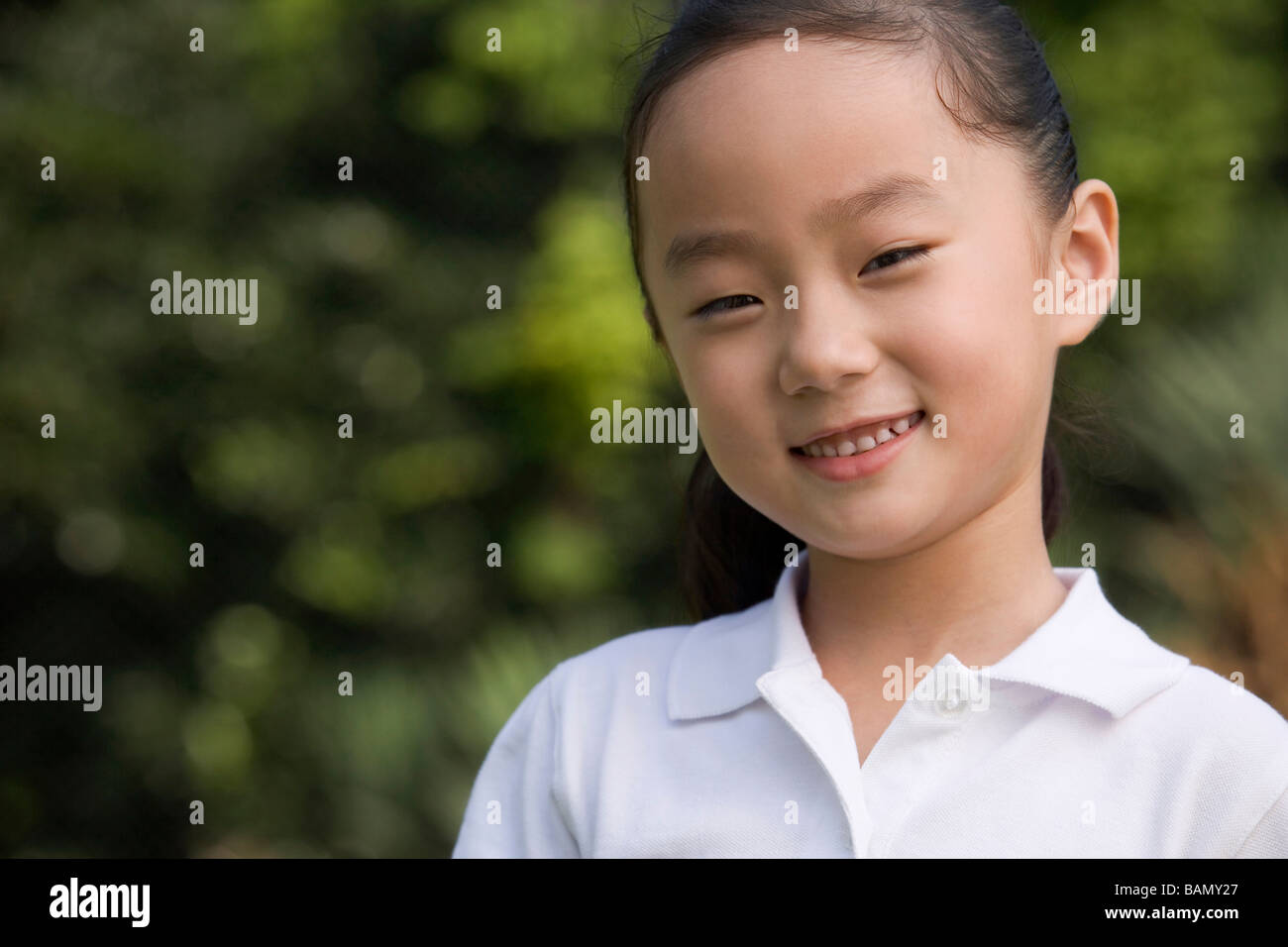 Portrait of a smiling little girl Stock Photo - Alamy