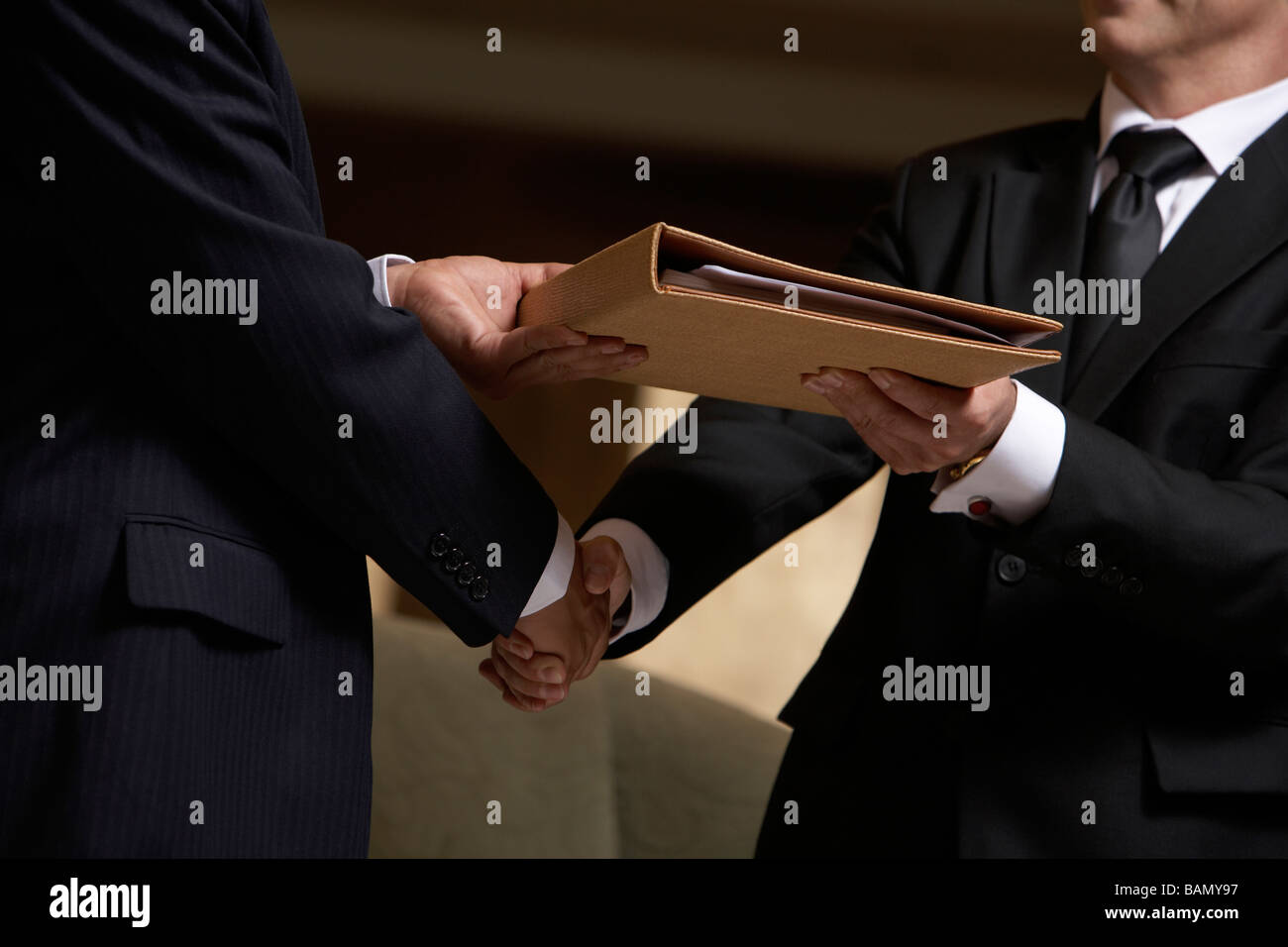 The passing of a signed contract Stock Photo - Alamy