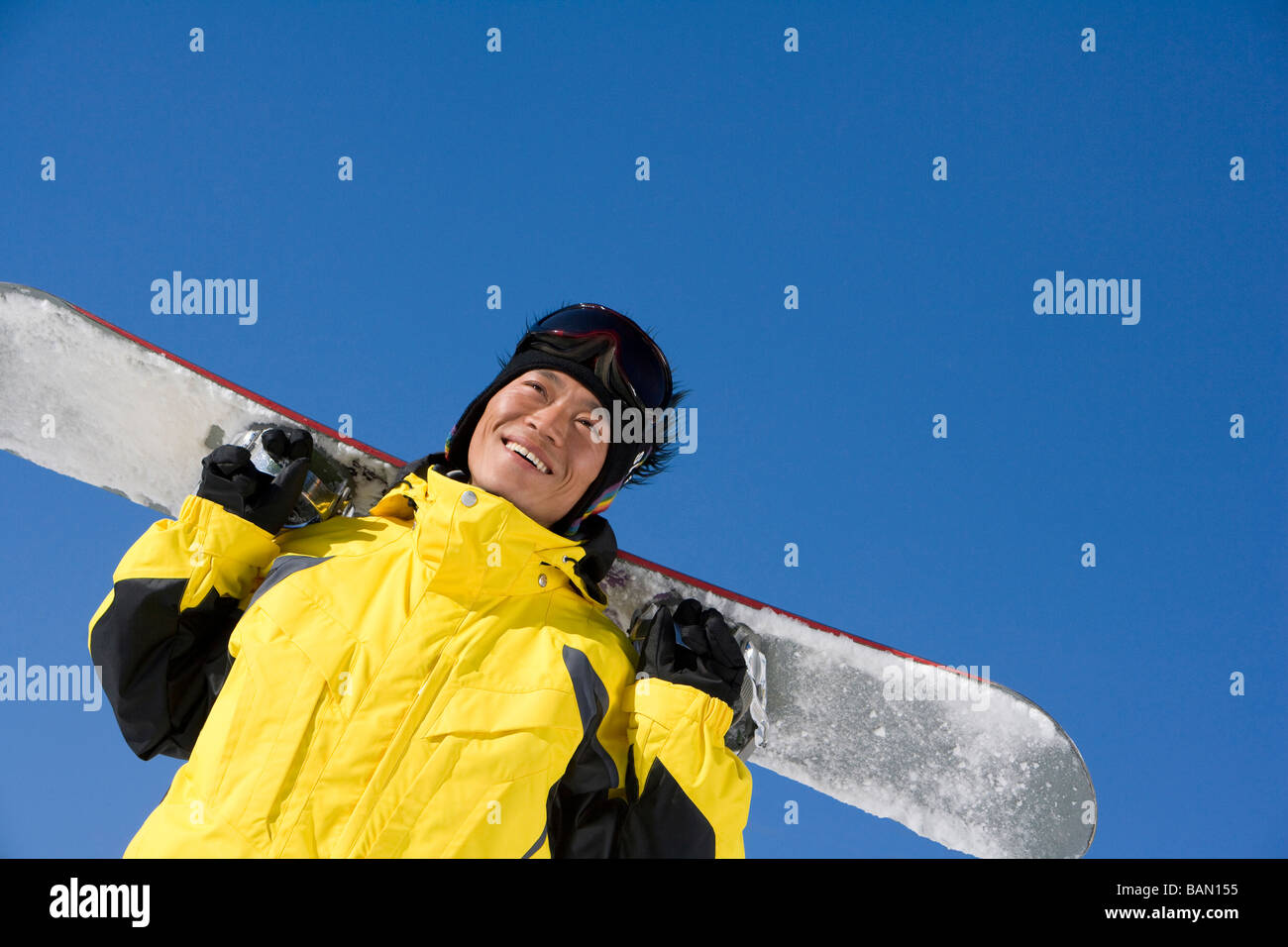 Young man with his snowboard Stock Photo - Alamy