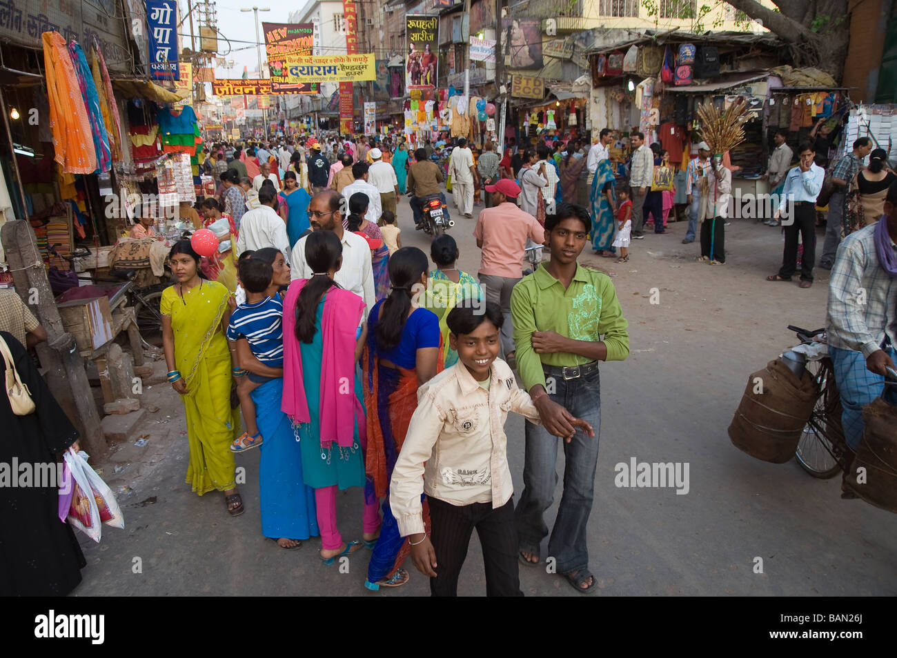 Indian people in a shopping area of the old city of Varanasi Benares Uttar Pradesh India Stock Photo