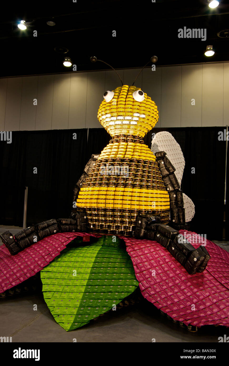 Canstruction charity event bumble bee figure made from tins of donated canned food that will be given to the Vancouver Food Bank Stock Photo