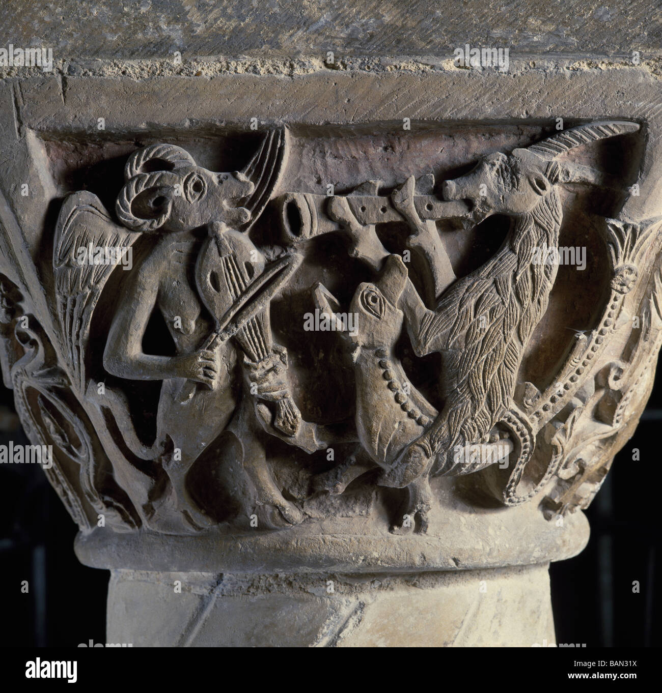 Canterbury Cathedral. Capital in the crypt showing beasts making music. Stock Photo
