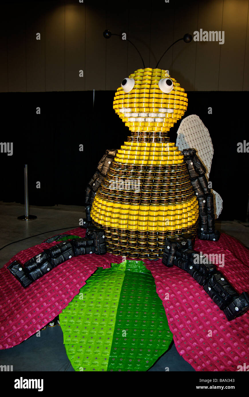 Canstruction charity event bumble bee figure made from tins of donated canned food that will be given to the Vancouver Food Bank Stock Photo