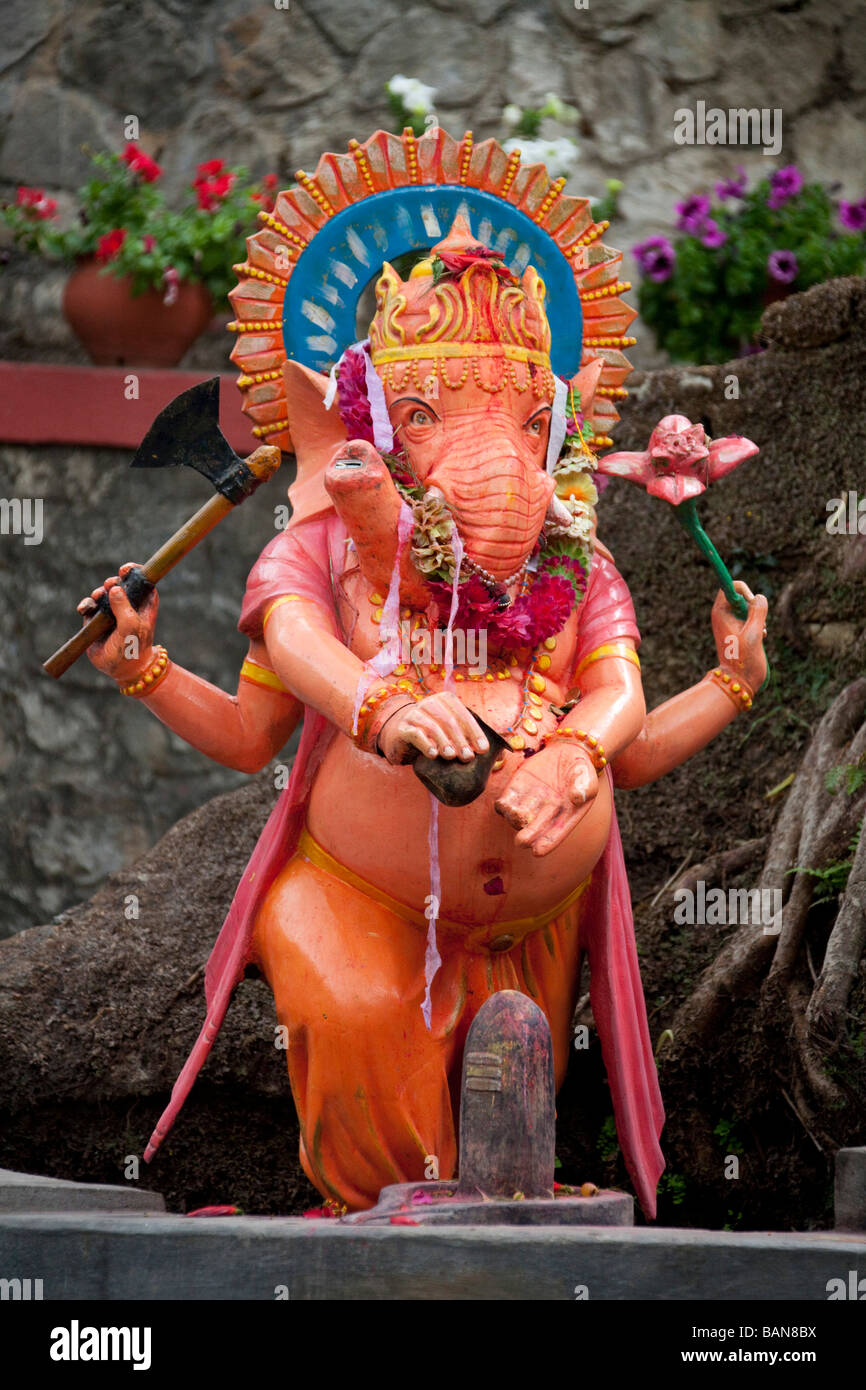 Orange Lord Ganesh elephant statue near holy cave Kathmandu Nepal 92985