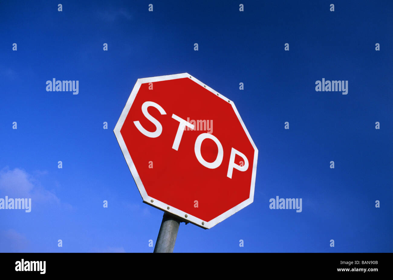 roadside stop sign at road junction near Leeds Yorkshire UK Stock Photo