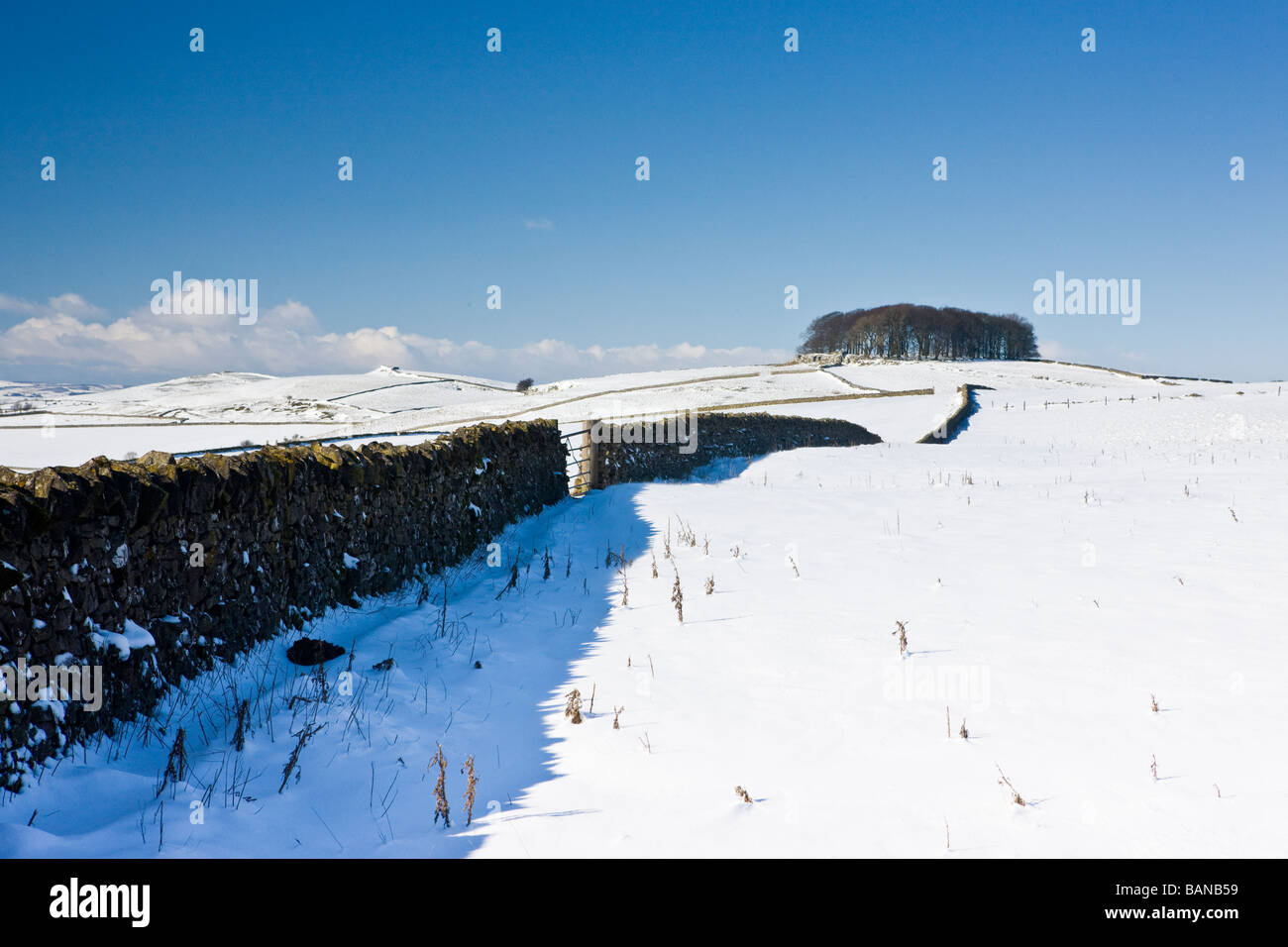 View across derbyshire countryside near Ashbourne in winter with snow on the ground Stock Photo