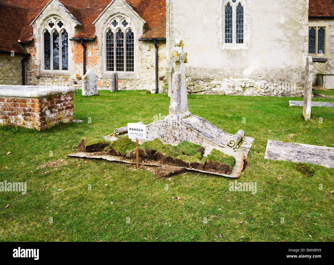 Old tombstone and a grave undergoing restoration. St. John the Baptist church in the village of Boldre, rural Hampshire. UK. Stock Photo