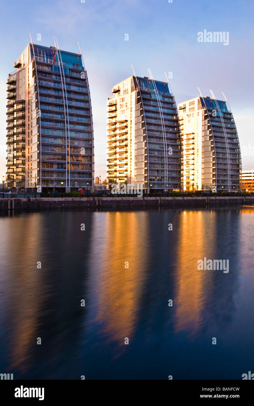 NV buildings reflected in Salford Quays docks, Manchester, England, UK Stock Photo