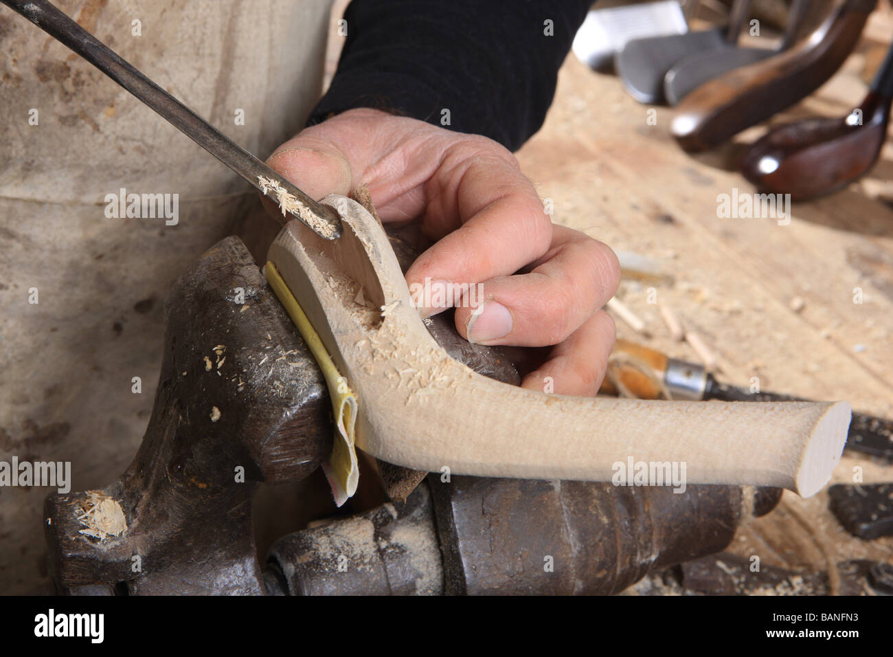 Sean Davies making traditional wooden golf clubs in his at