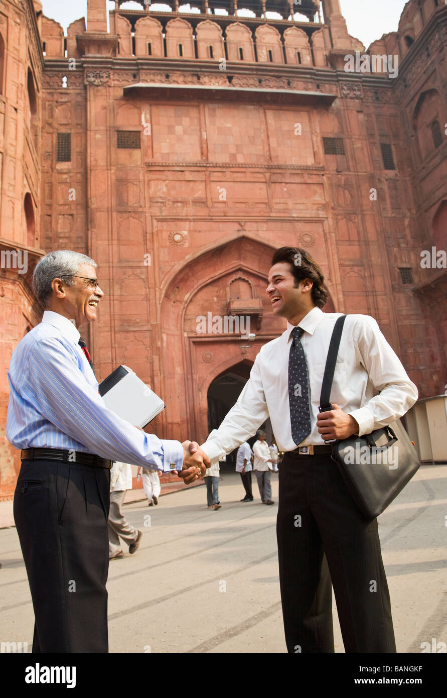 Indian businessman shaking hands at the Red Fort Stock Photo