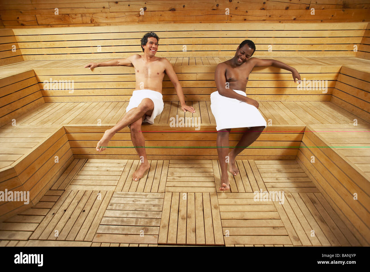 Two multi-ethnic men relaxing in sauna Stock Photo - Alamy