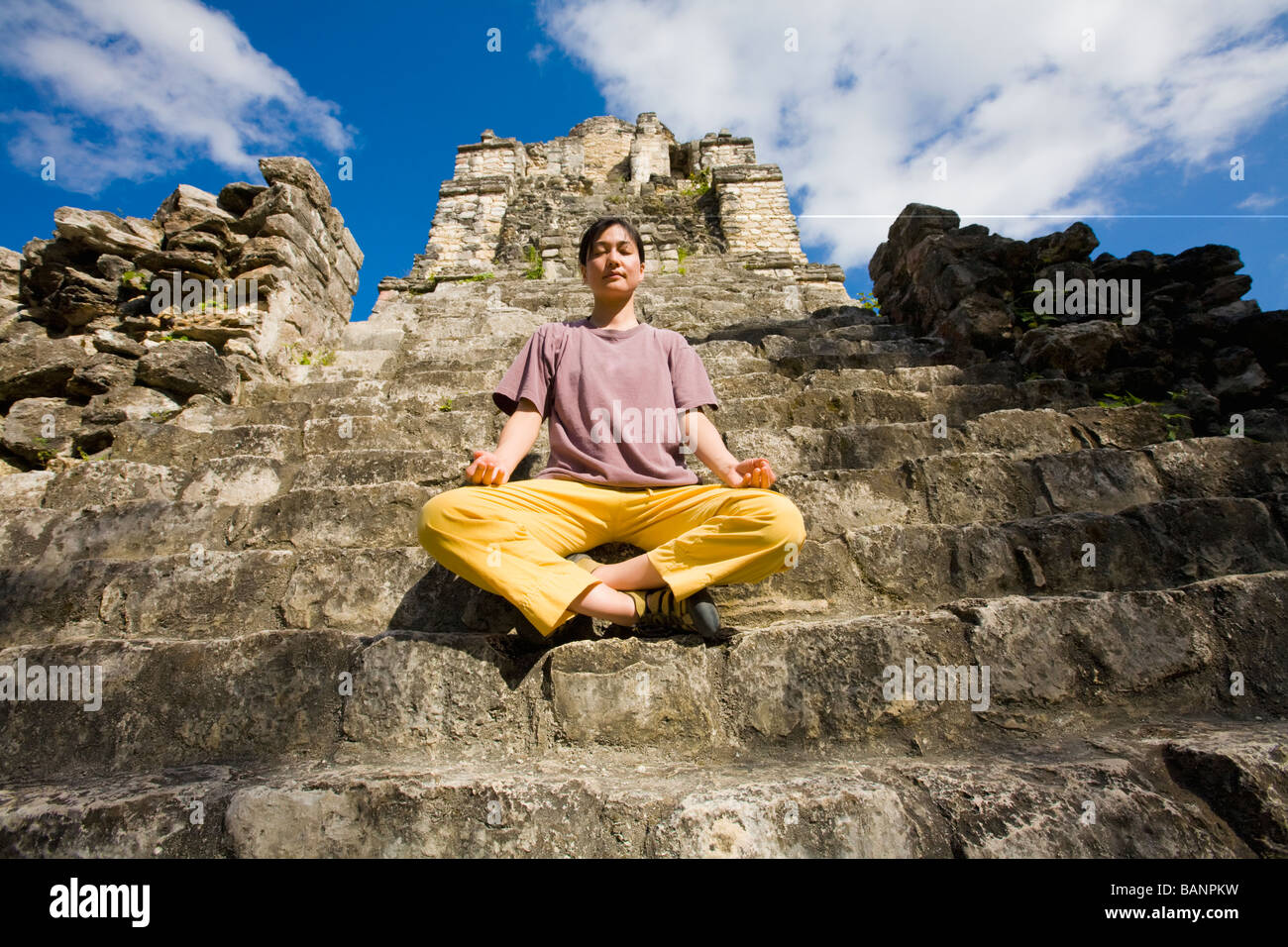 Woman sitting in front temple hi-res stock photography and images - Alamy
